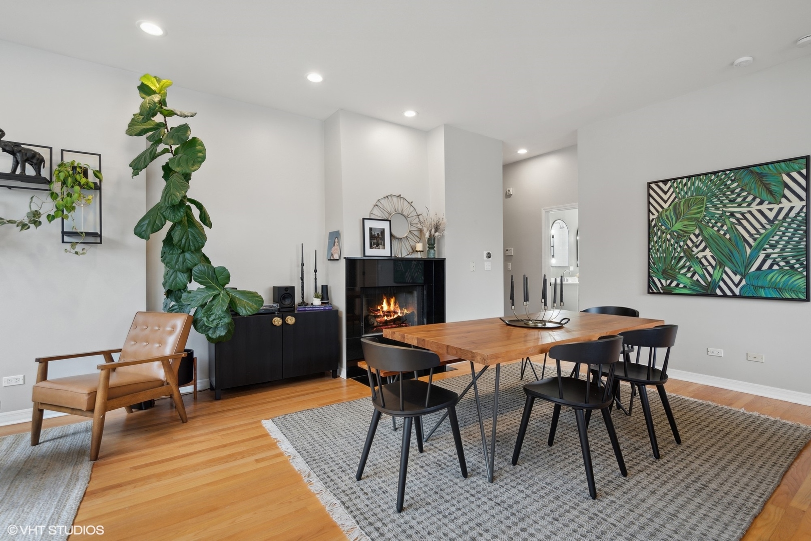 958 North Wood Street, Unit A Chicago, IL 60622 - Photo 6 of 17 a dining room with furniture potted plants and wooden floor