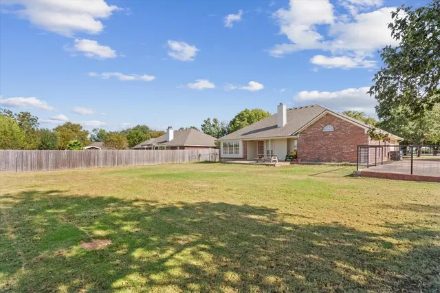 a view of a lake with houses in the back