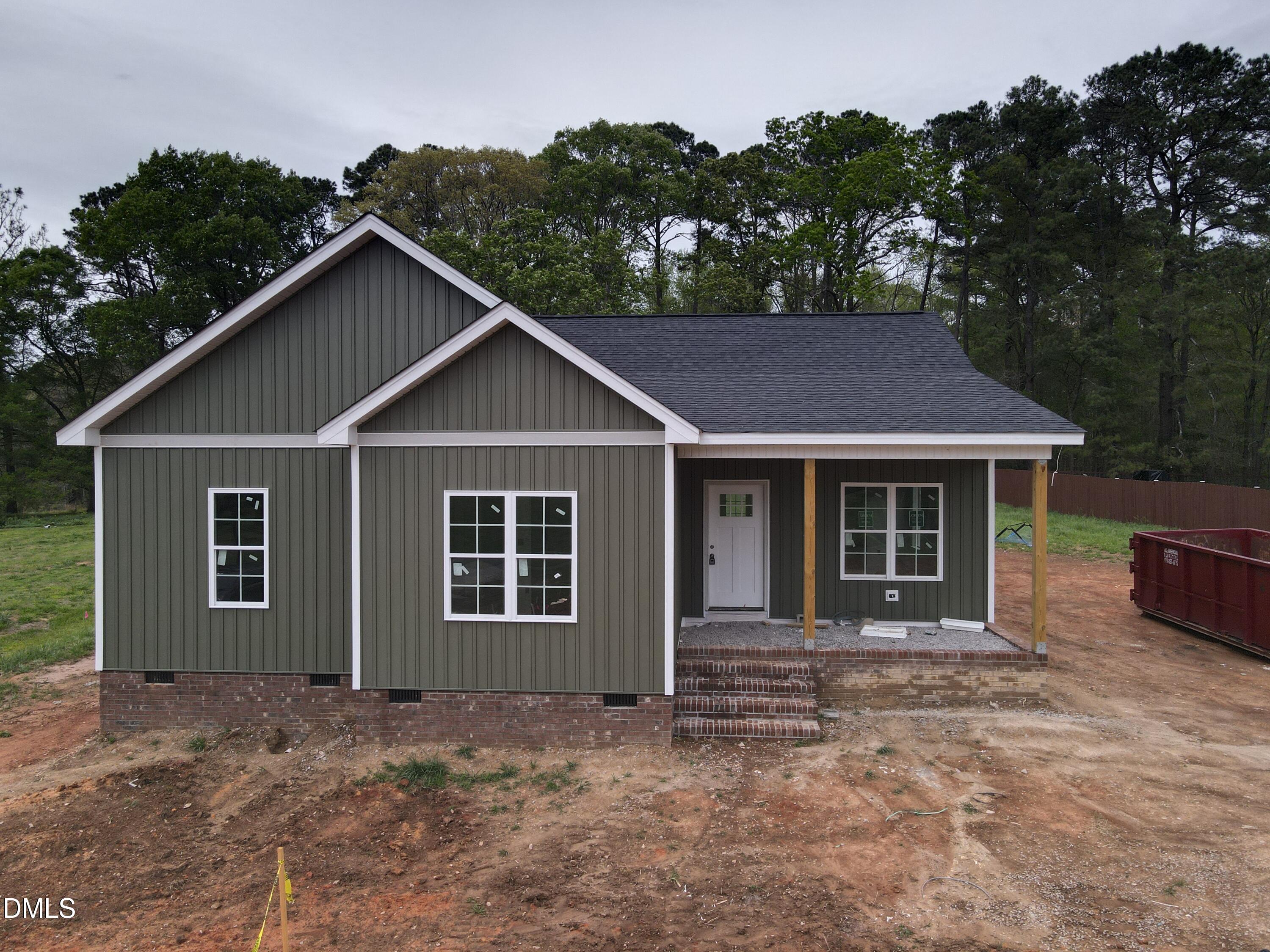 a view of a house with a yard and garage