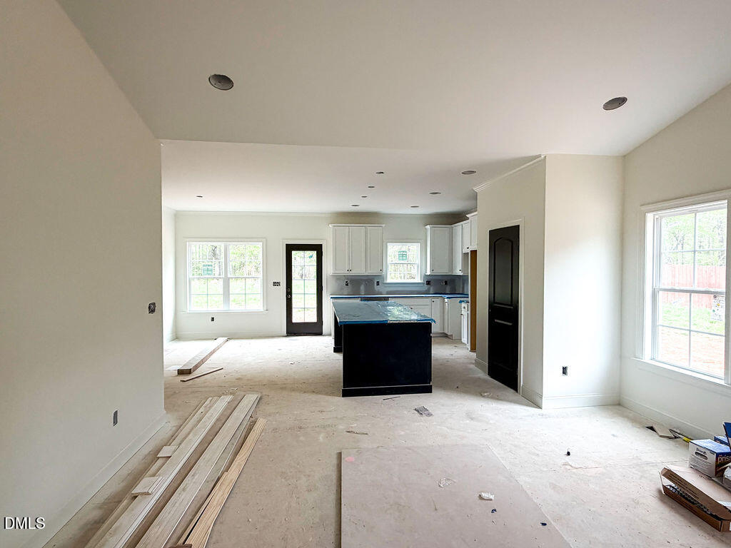 9574 Stallings Road Spring Hope, NC 27882 - Photo 11 of 31 a large bedroom with a bed and a large window