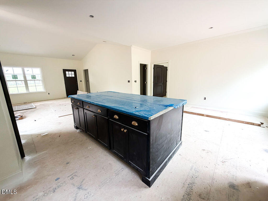9574 Stallings Road Spring Hope, NC 27882 - Photo 13 of 31 a room with a sink and wooden floor