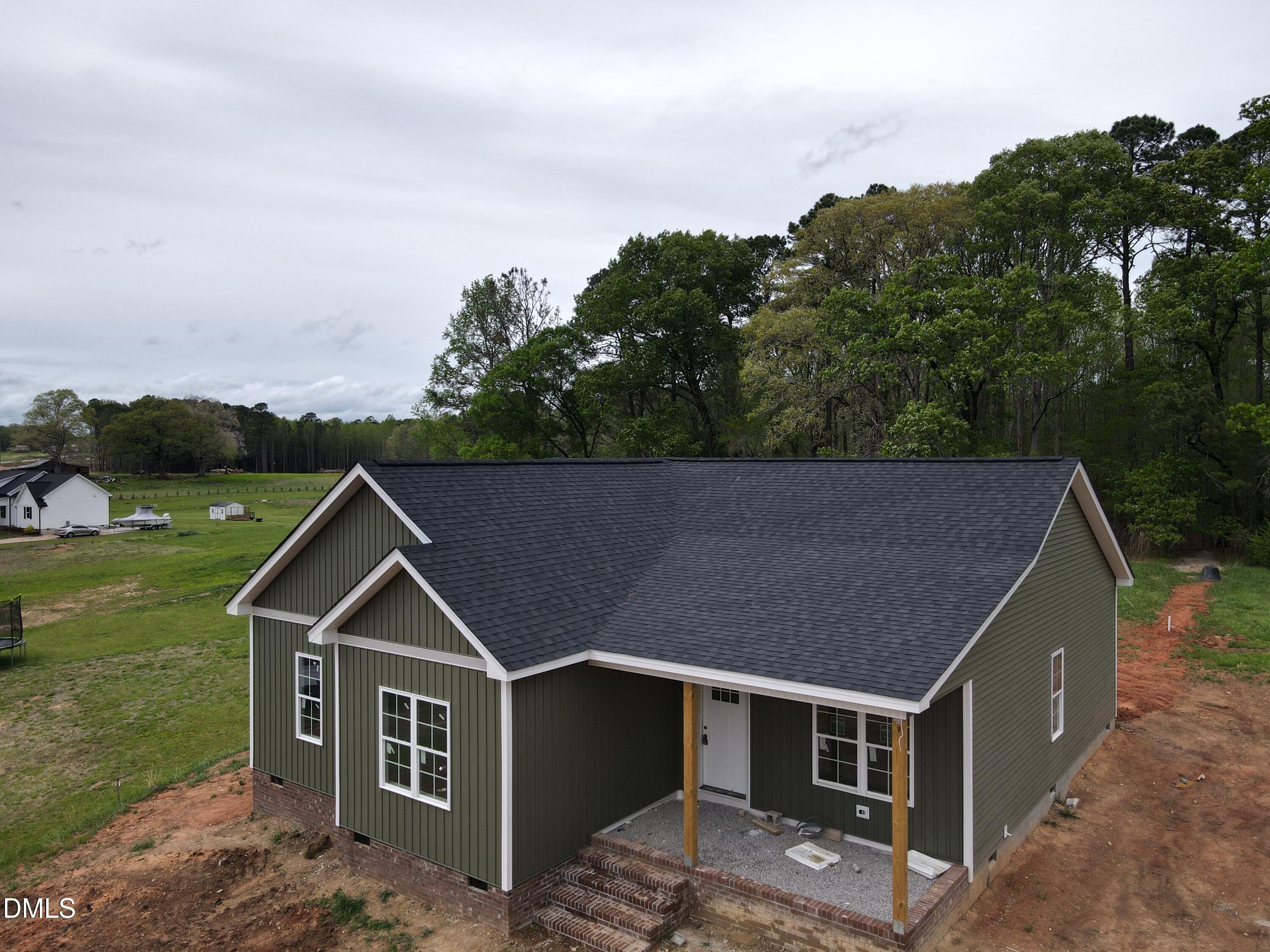 9574 Stallings Road Spring Hope, NC 27882 - Photo 2 of 31 a house view with a garden space