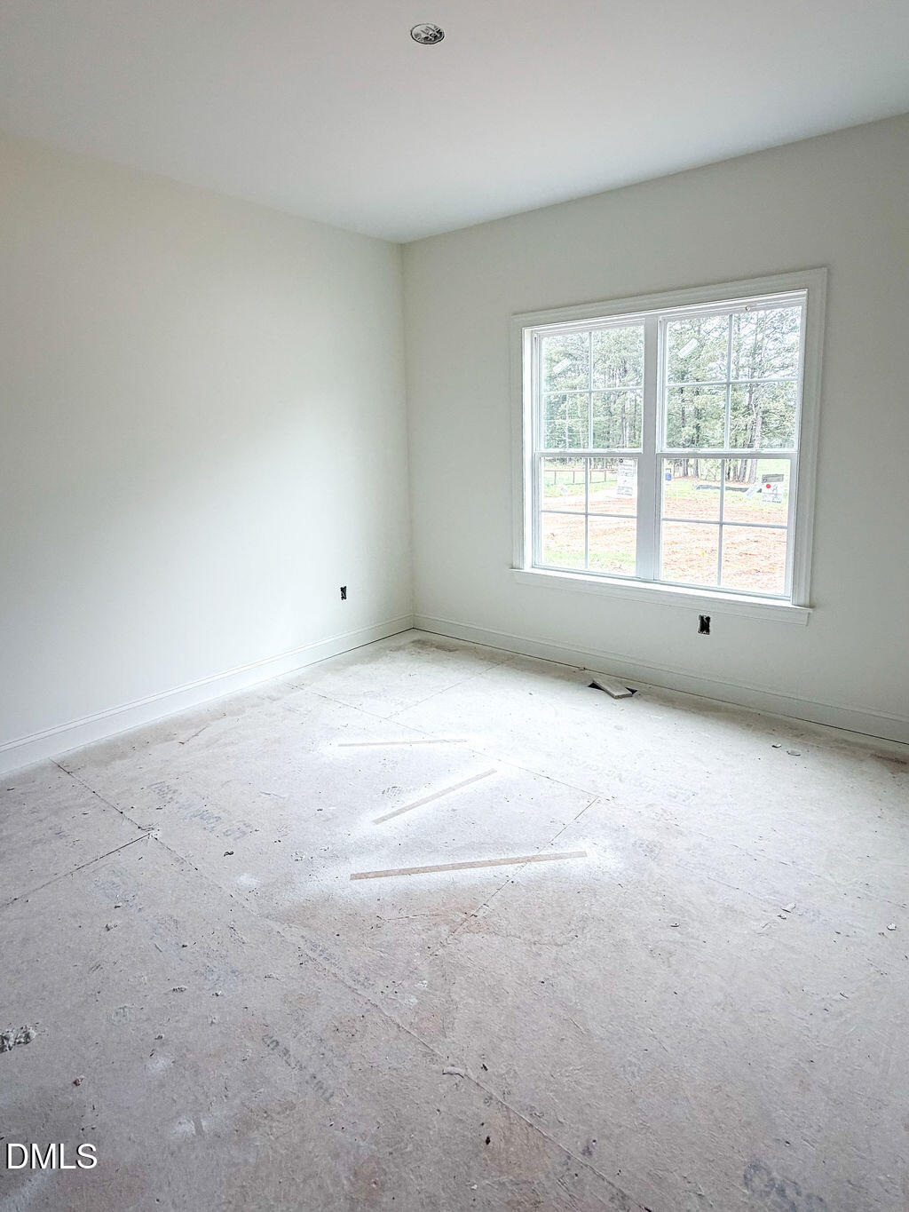 9574 Stallings Road Spring Hope, NC 27882 - Photo 25 of 31 a view of an empty room with a window