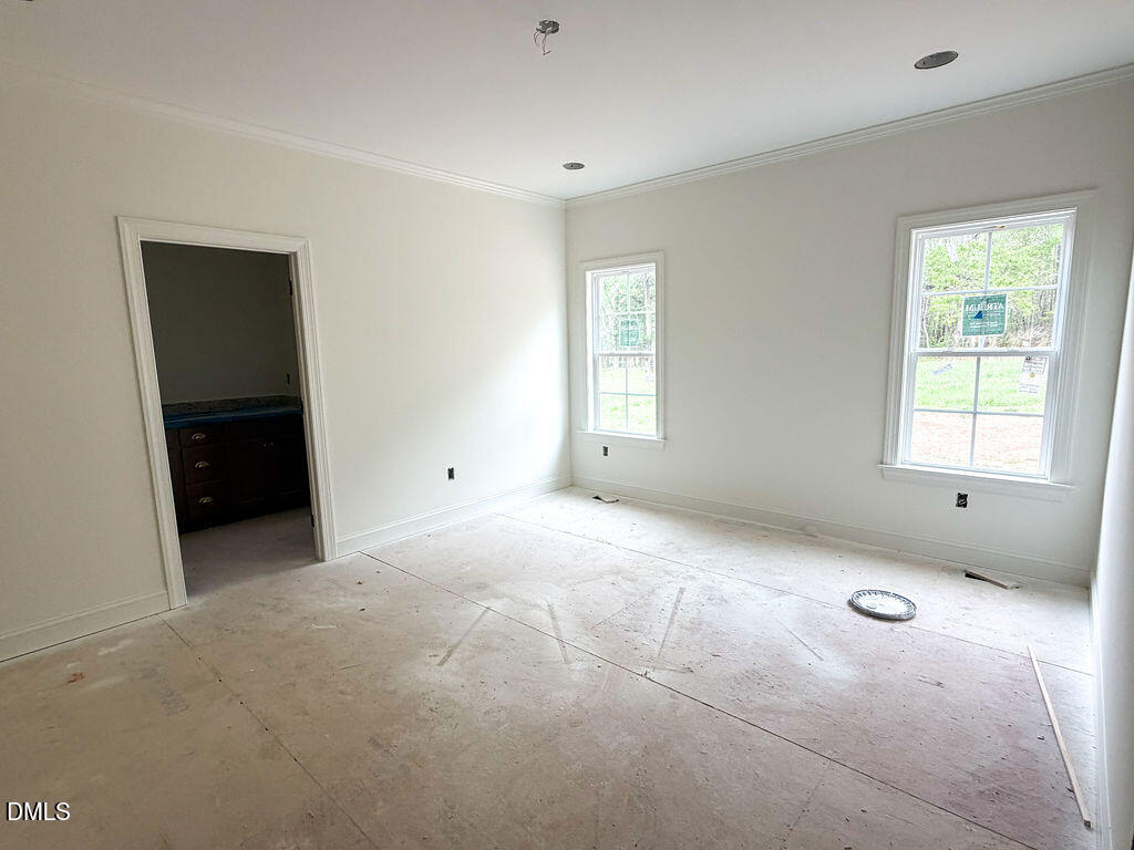9574 Stallings Road Spring Hope, NC 27882 - Photo 26 of 31 a view of empty room with windows
