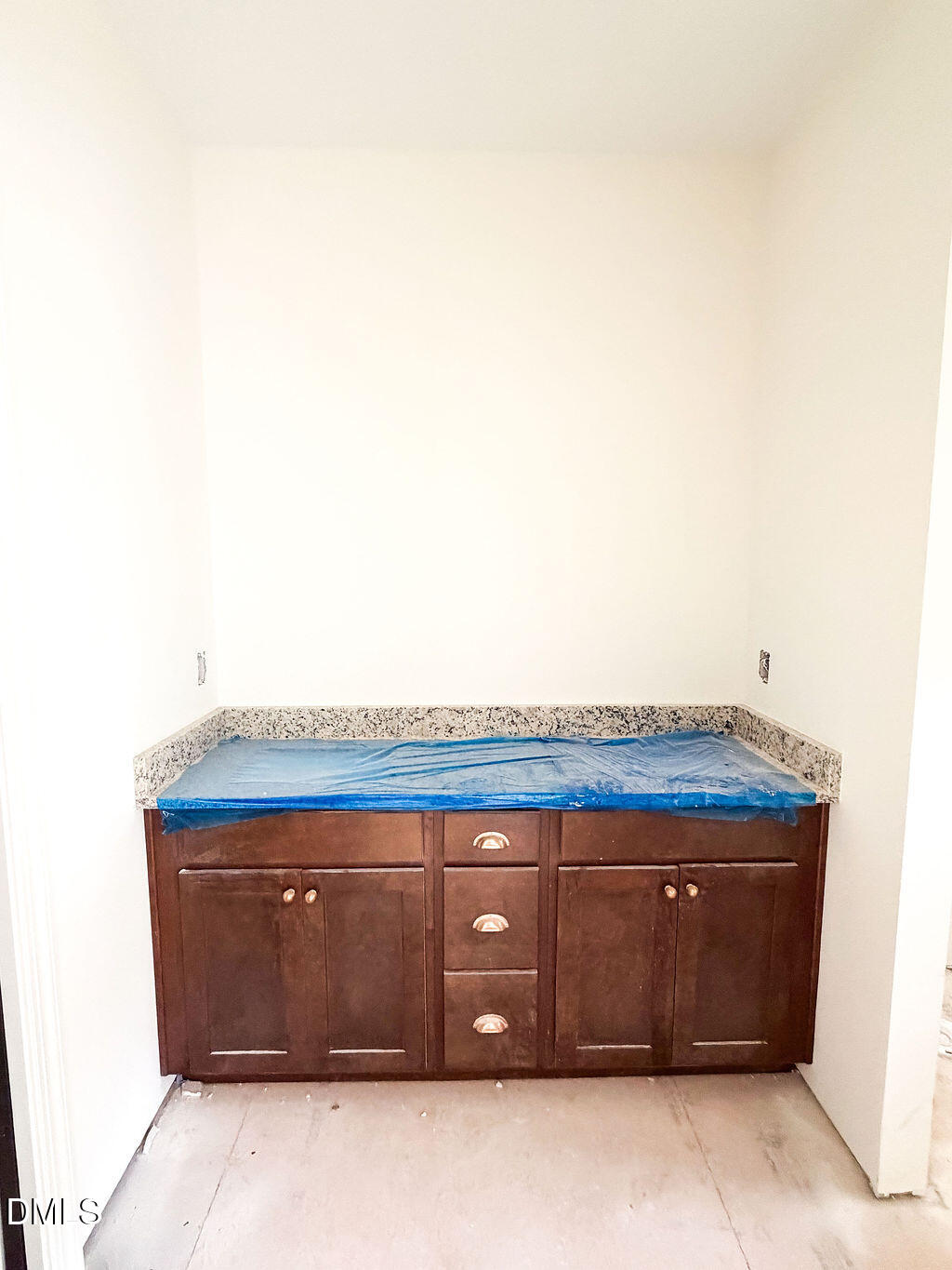 9574 Stallings Road Spring Hope, NC 27882 - Photo 27 of 31 a view of wooden cabinets