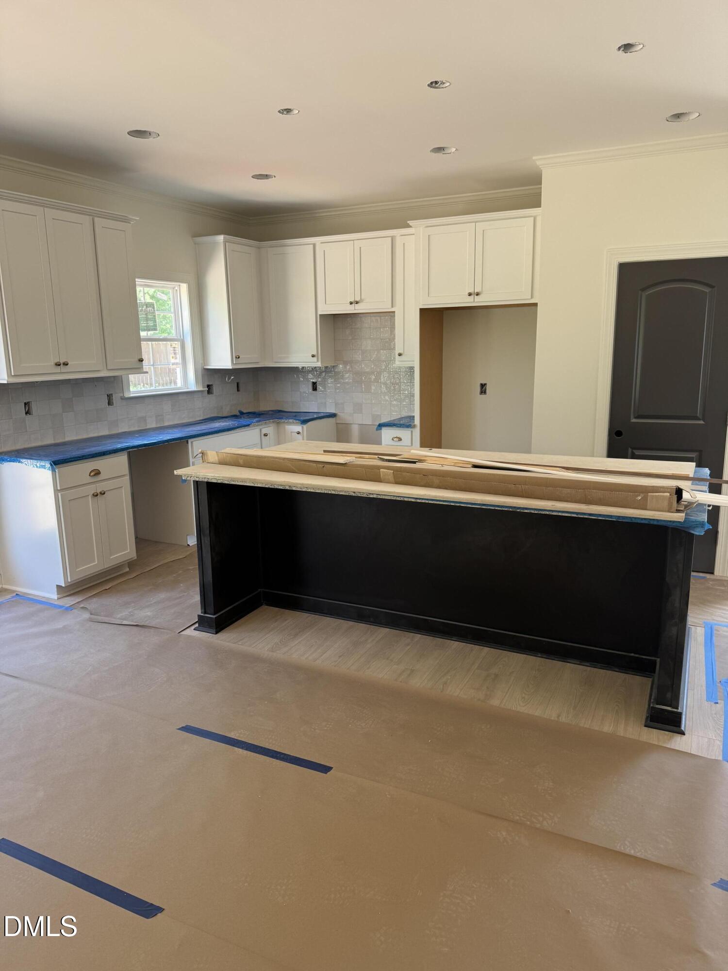 9574 Stallings Road Spring Hope, NC 27882 - Photo 30 of 31 a kitchen with stainless steel appliances granite countertop a sink and a stove