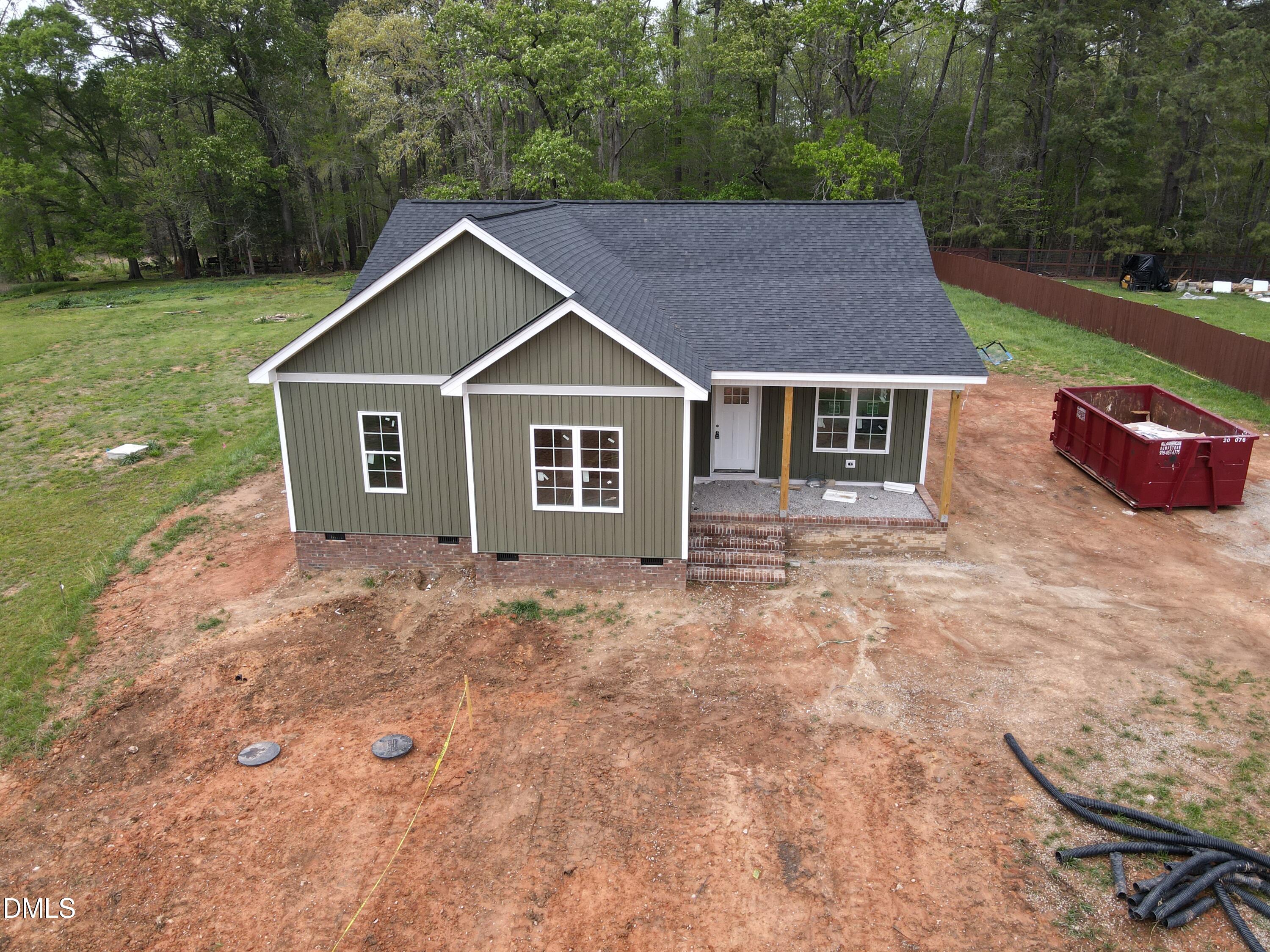 9574 Stallings Road Spring Hope, NC 27882 - Photo 3 of 31 a view of a house with yard and a garden