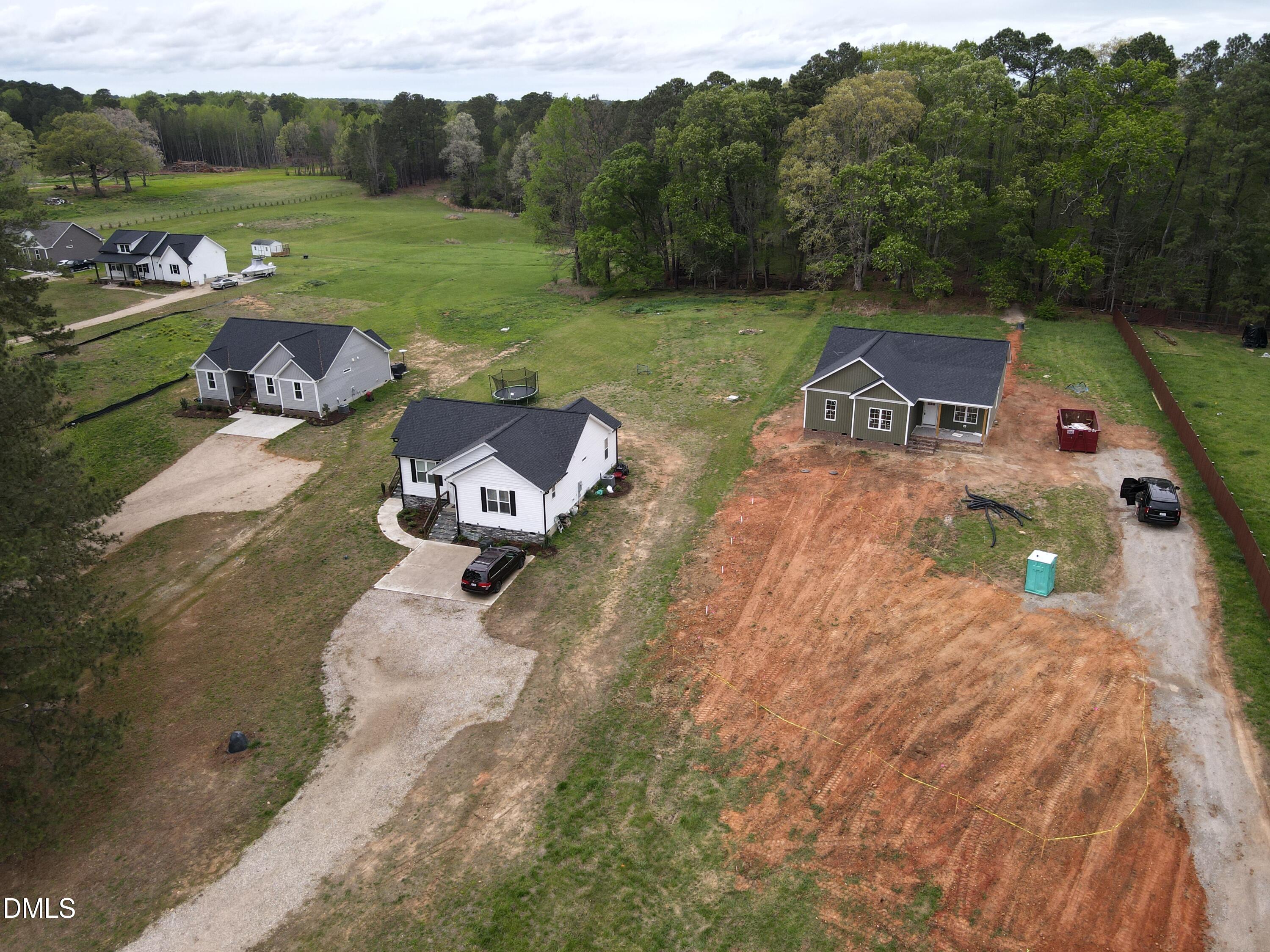 9574 Stallings Road Spring Hope, NC 27882 - Photo 5 of 31 a view of a lake with a yard