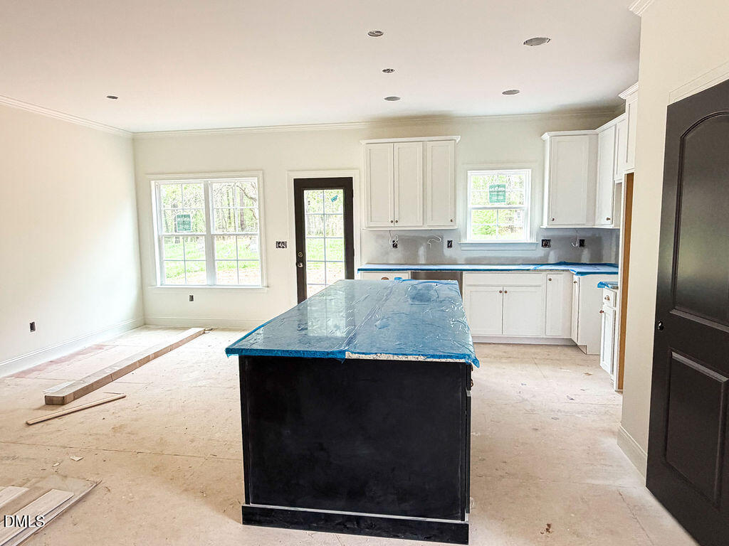 9574 Stallings Road Spring Hope, NC 27882 - Photo 10 of 31 a kitchen with stainless steel appliances granite countertop a stove a sink and a refrigerator