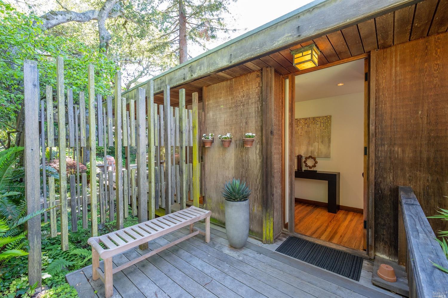 a view of a balcony with furniture