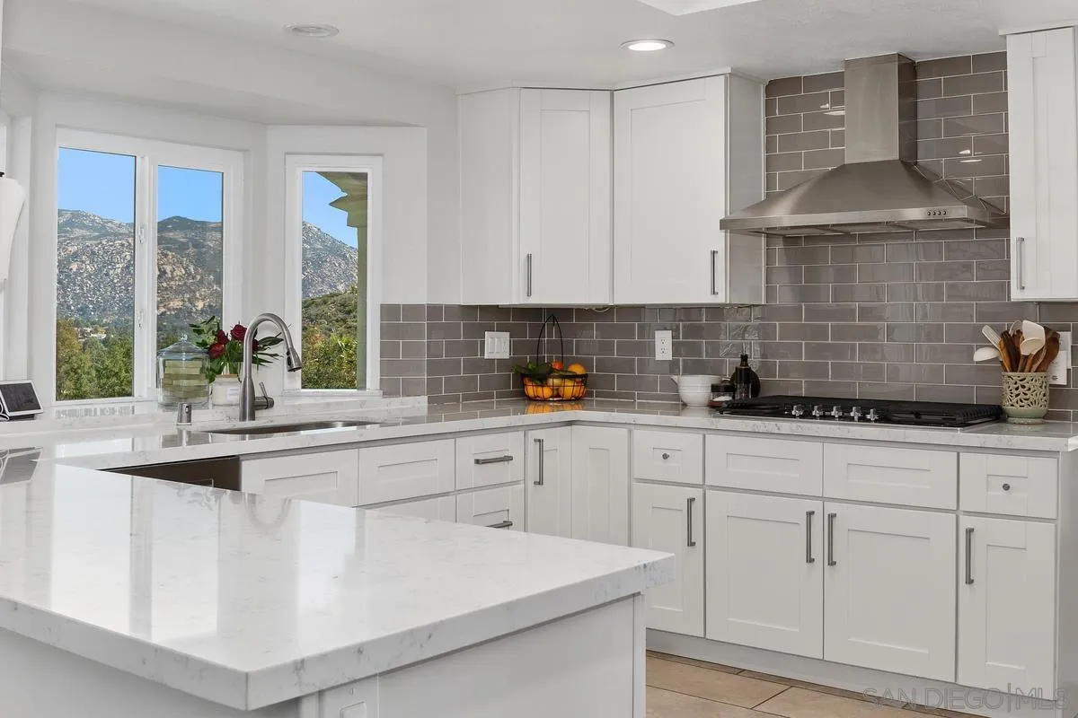 23969 Nectar Way Ramona, CA 92065 - Photo 19 of 54 a kitchen with white cabinets and a sink