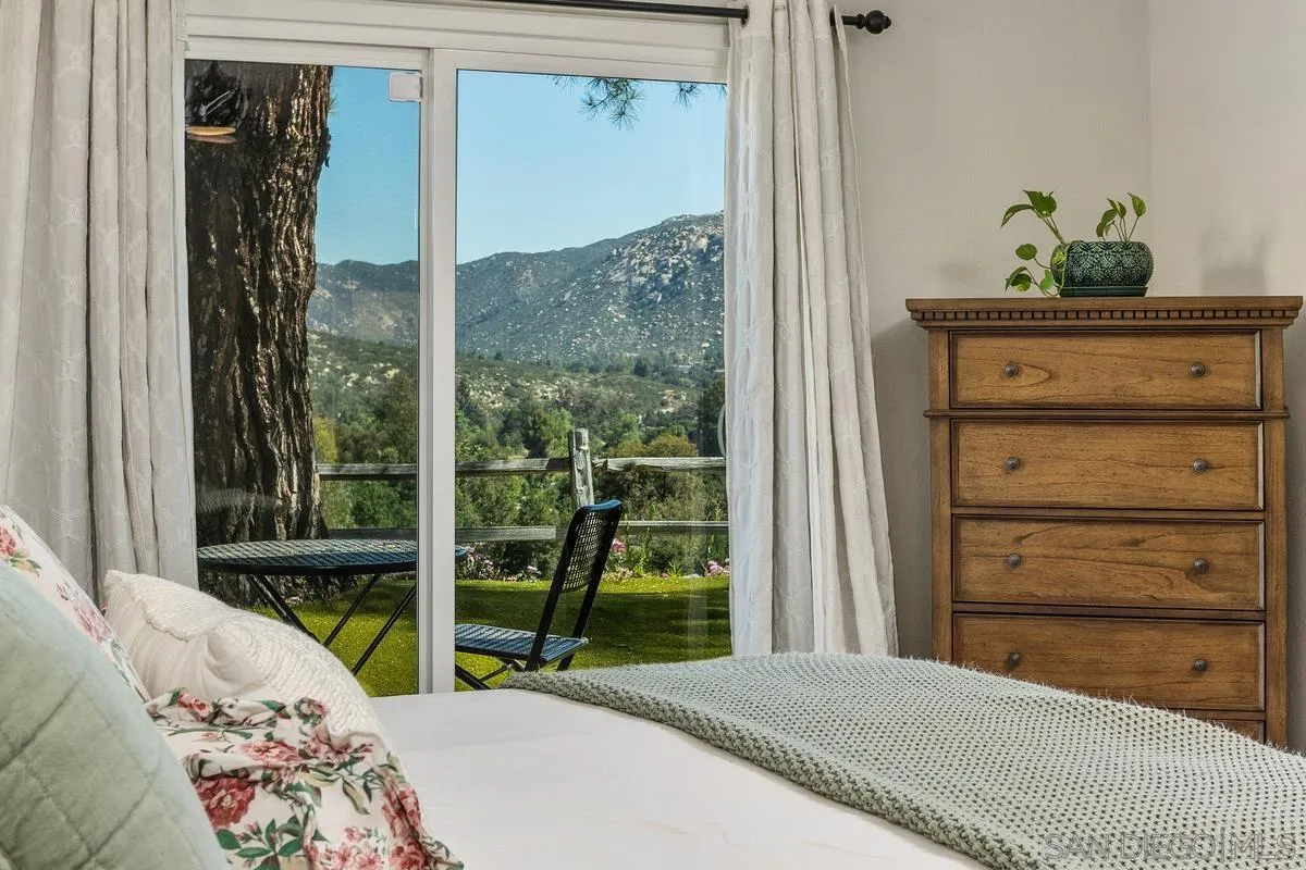 23969 Nectar Way Ramona, CA 92065 - Photo 2 of 54 a bedroom with a bed and a window