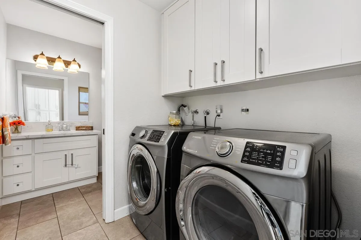 23969 Nectar Way Ramona, CA 92065 - Photo 22 of 54 a view of washer and dryer with bathroom in the background
