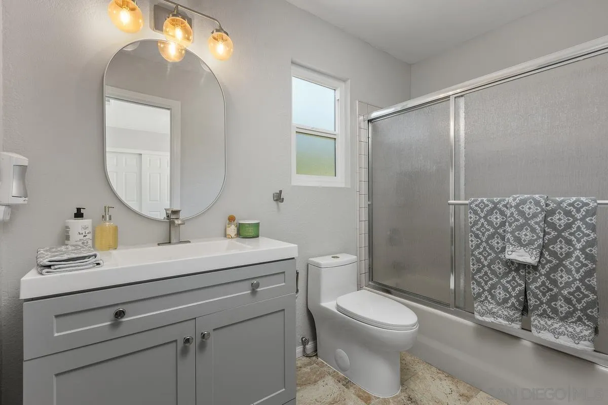 23969 Nectar Way Ramona, CA 92065 - Photo 38 of 54 a bathroom with a toilet a sink and mirror