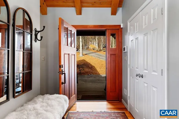 a bathroom with a shower sink and mirror