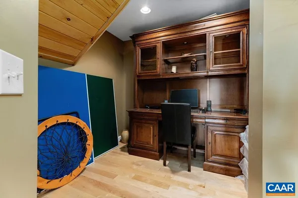 a view of front door with wooden floor and livingroom view