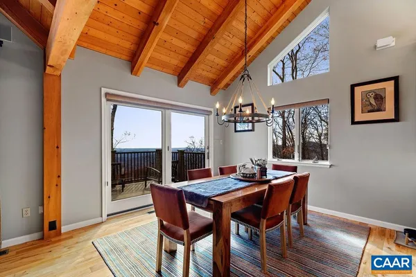 a view of balcony with wooden floor and fence
