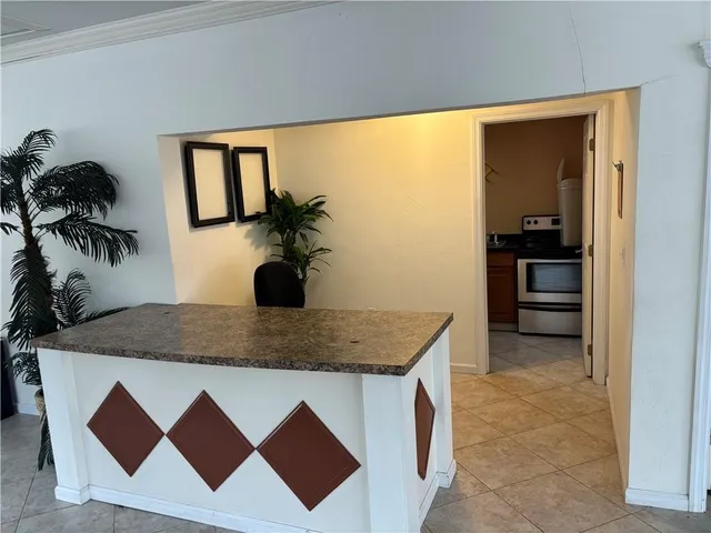 a kitchen with a sink a counter top space and cabinets