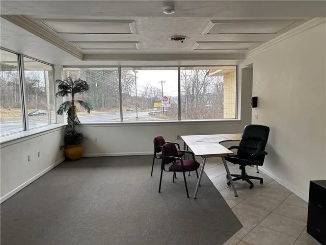 a workspace with furniture and a window