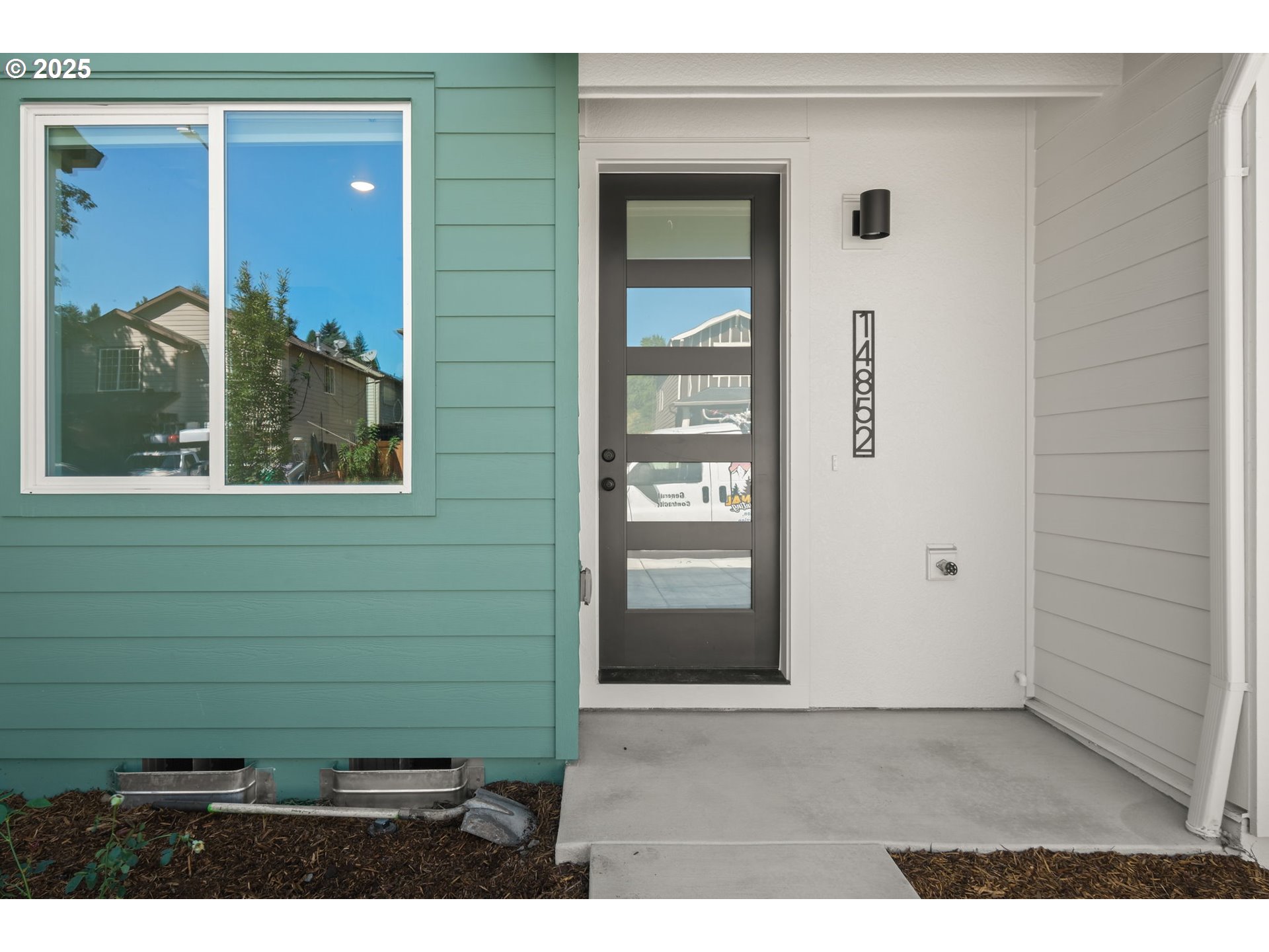 14852 Northeast Couch Street, Unit 9 Portland, OR 97230 - Photo 1 of 42 a view of a door and a window