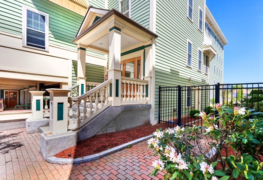 426 Main Street, Unit 402 Melrose, MA 02176 - Photo 22 of 24 a view of a house with wooden floor and a potted plant
