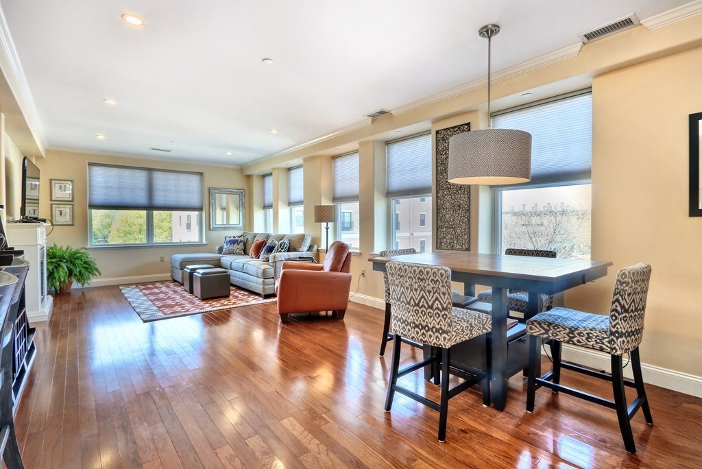 426 Main Street, Unit 402 Melrose, MA 02176 - Photo 3 of 24 a view of a livingroom with furniture window and wooden floor