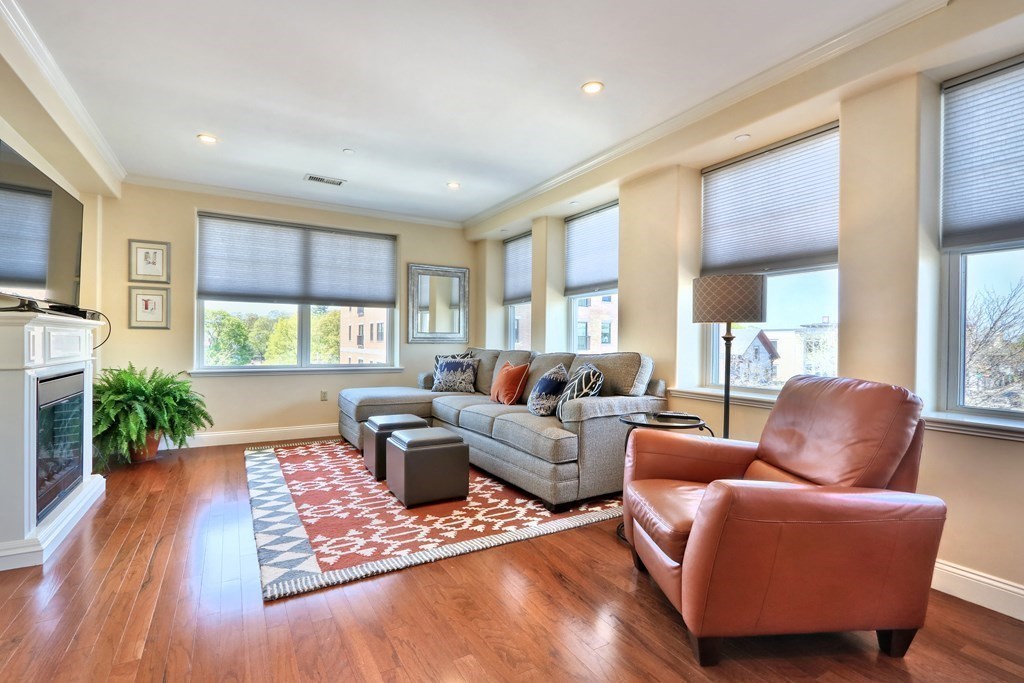 426 Main Street, Unit 402 Melrose, MA 02176 - Photo 7 of 24 a living room with furniture rug and window