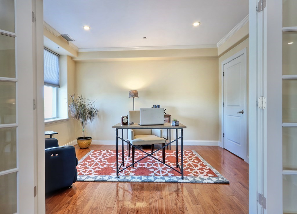 426 Main Street, Unit 402 Melrose, MA 02176 - Photo 10 of 24 a workspace room with furniture and wooden floor