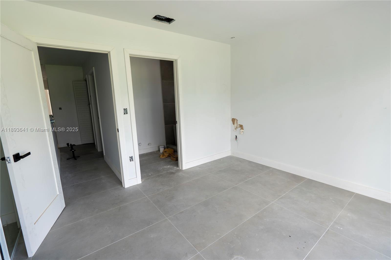 10290 Southwest 174th Terrace Miami, FL 33157 - Photo 14 of 15 an empty room with closet