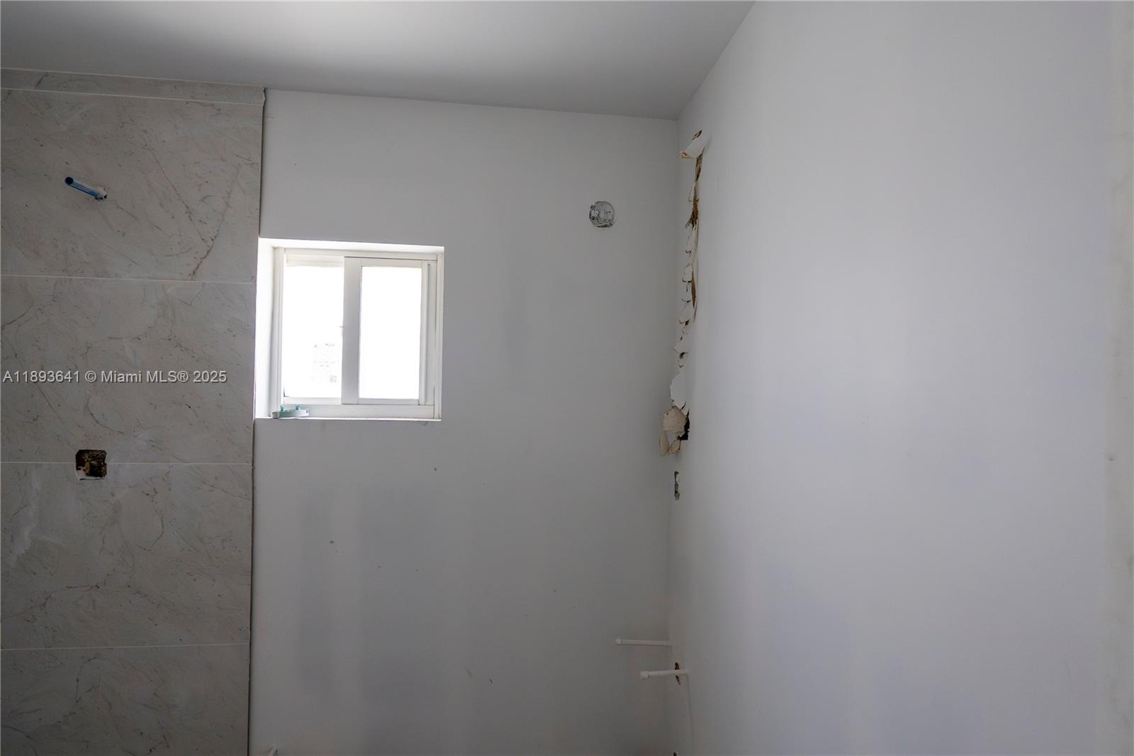 10290 Southwest 174th Terrace Miami, FL 33157 - Photo 15 of 15 a bathroom with a window