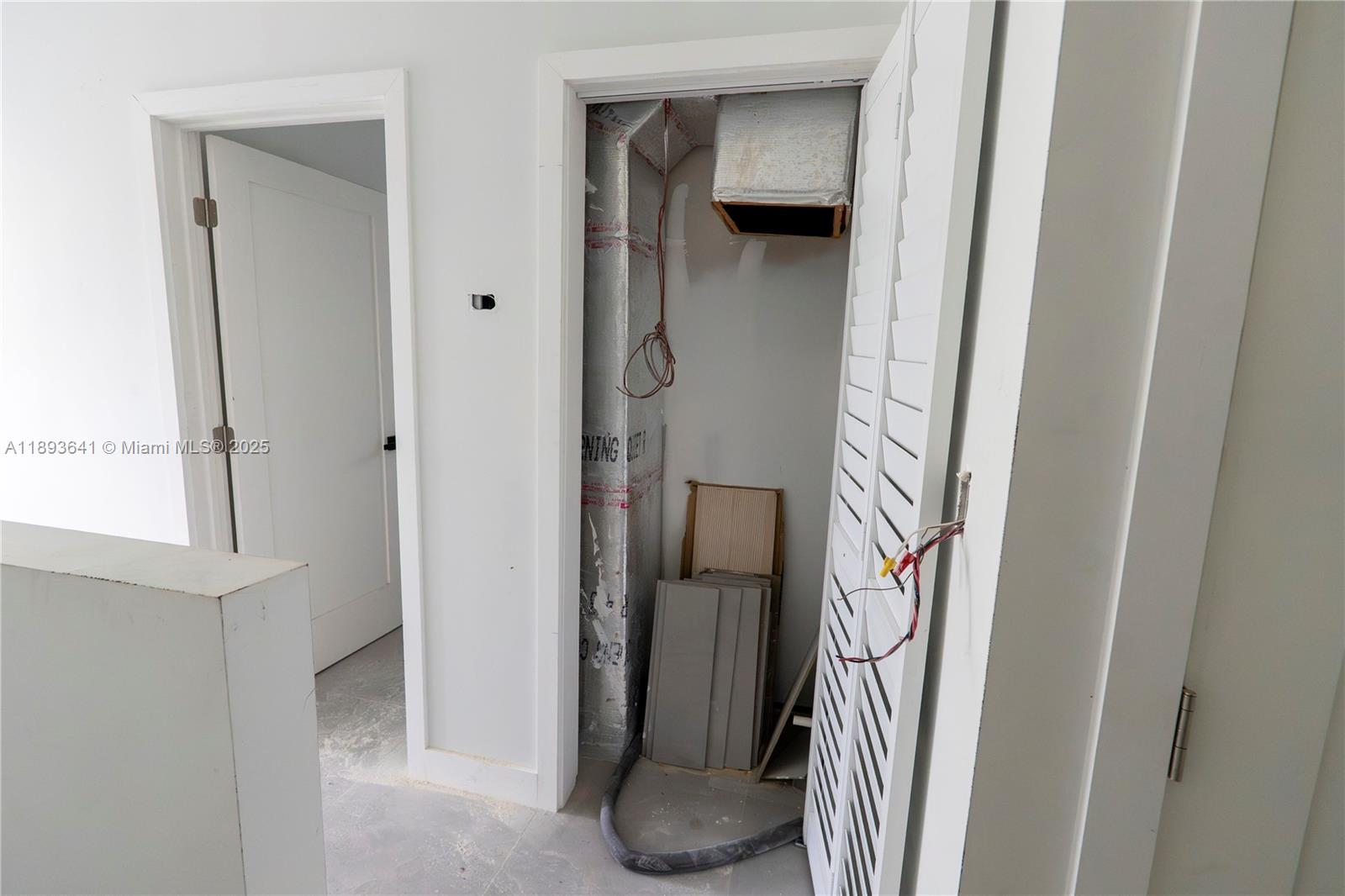 10290 Southwest 174th Terrace Miami, FL 33157 - Photo 4 of 15 a view of a walk in closet and bathroom