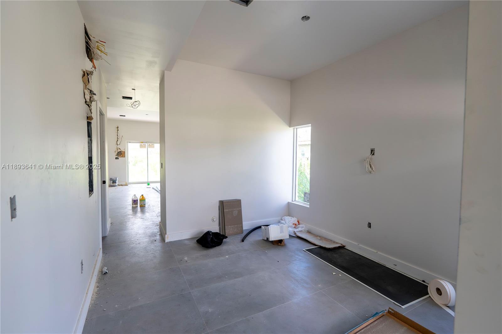 10290 Southwest 174th Terrace Miami, FL 33157 - Photo 9 of 15 a view of empty room with a window