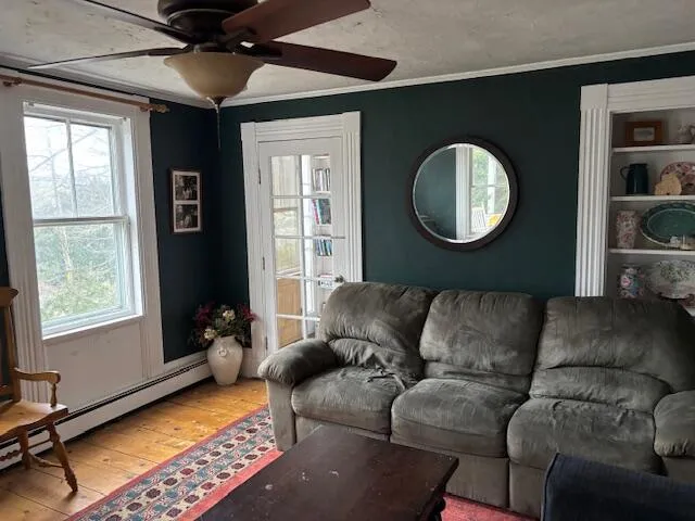 a living room with furniture and a window