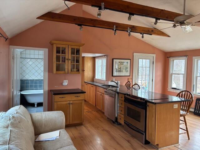19 Monument Road Orleans, MA 02653 - Photo 4 of 20 a kitchen with stainless steel appliances granite countertop a stove and a sink