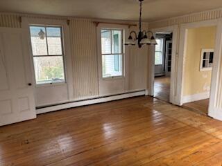 19 Monument Road Orleans, MA 02653 - Photo 6 of 20 an empty room with wooden floor and windows
