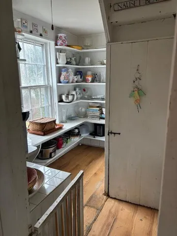 a bathroom with a toilet a sink and a window