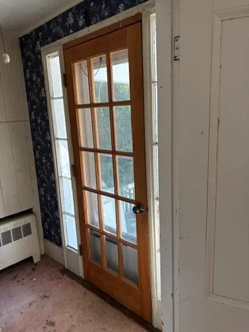 a view of storage and utility room with washer and dryer