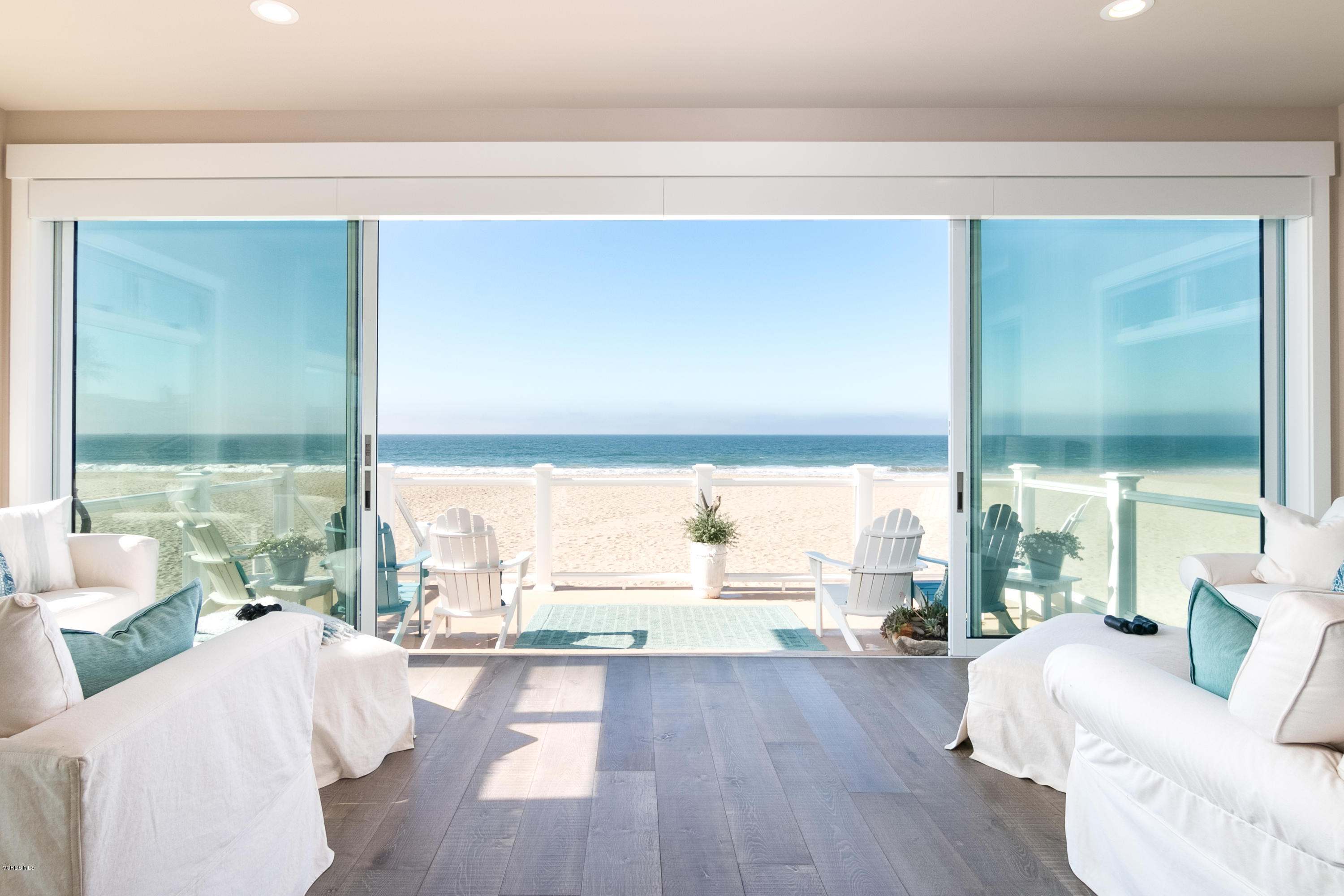 935 Mandalay Beach Road Oxnard, CA 93035 - Photo 1 of 67 a living room with furniture and a large window