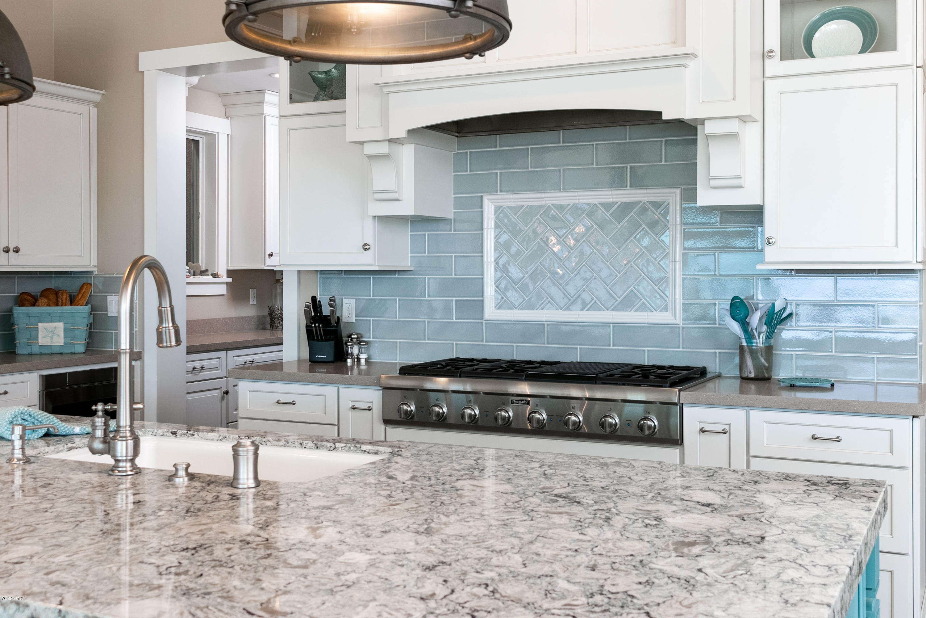 935 Mandalay Beach Road Oxnard, CA 93035 - Photo 14 of 67 a kitchen with granite countertop a stove a sink and a granite counter tops