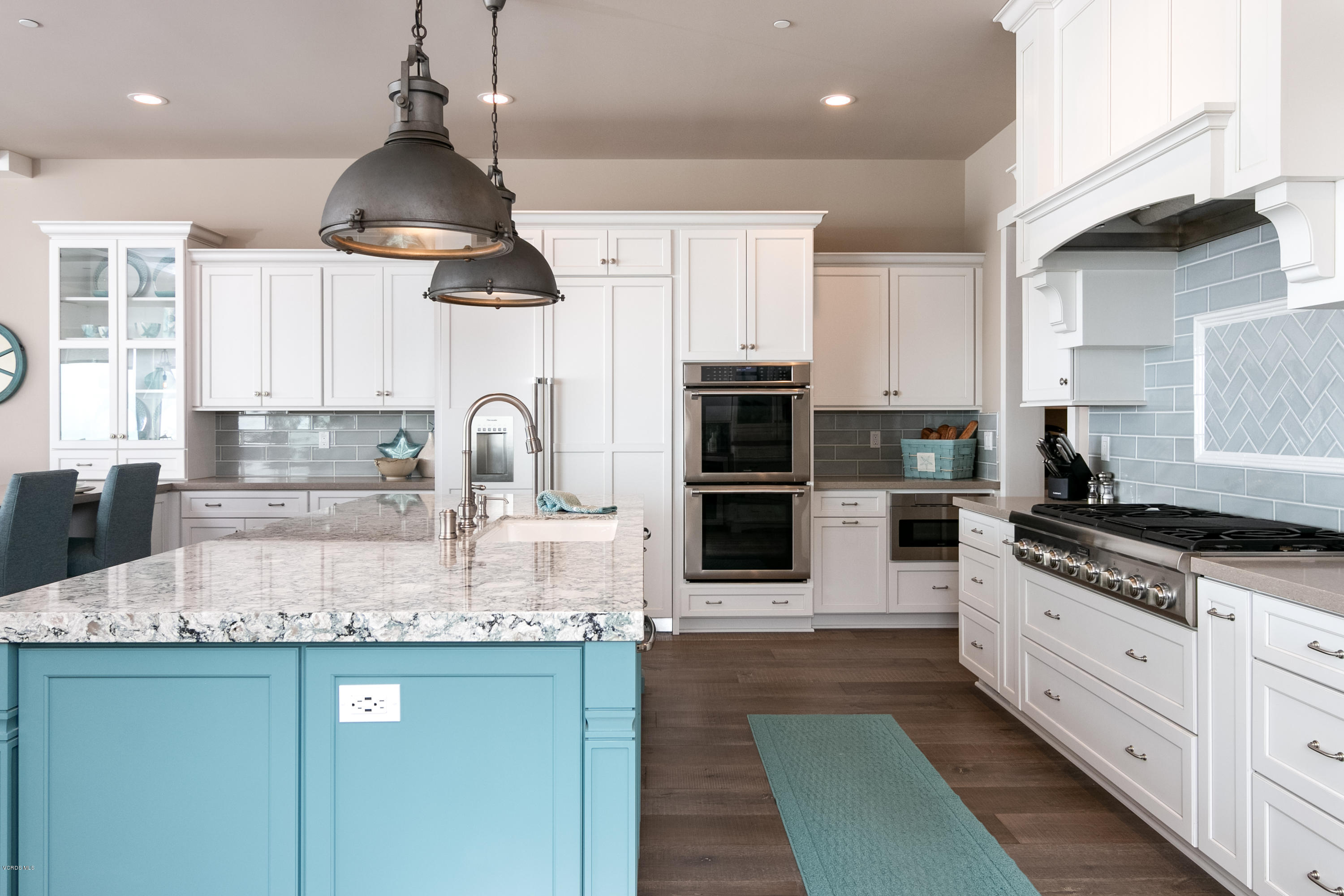 935 Mandalay Beach Road Oxnard, CA 93035 - Photo 15 of 67 a kitchen with stainless steel appliances granite countertop a sink stove and refrigerator