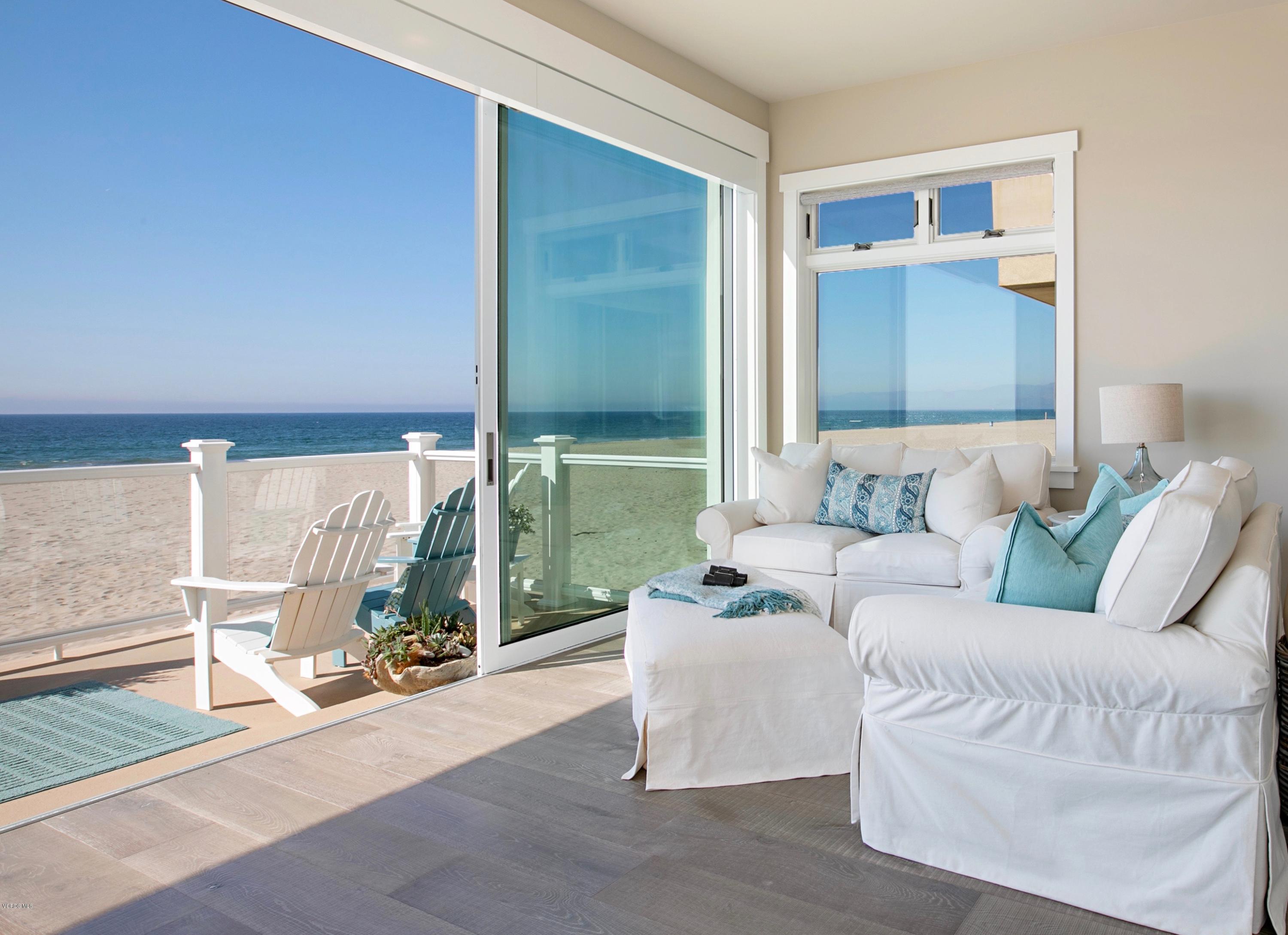 935 Mandalay Beach Road Oxnard, CA 93035 - Photo 19 of 67 a living room with furniture and a floor to ceiling window