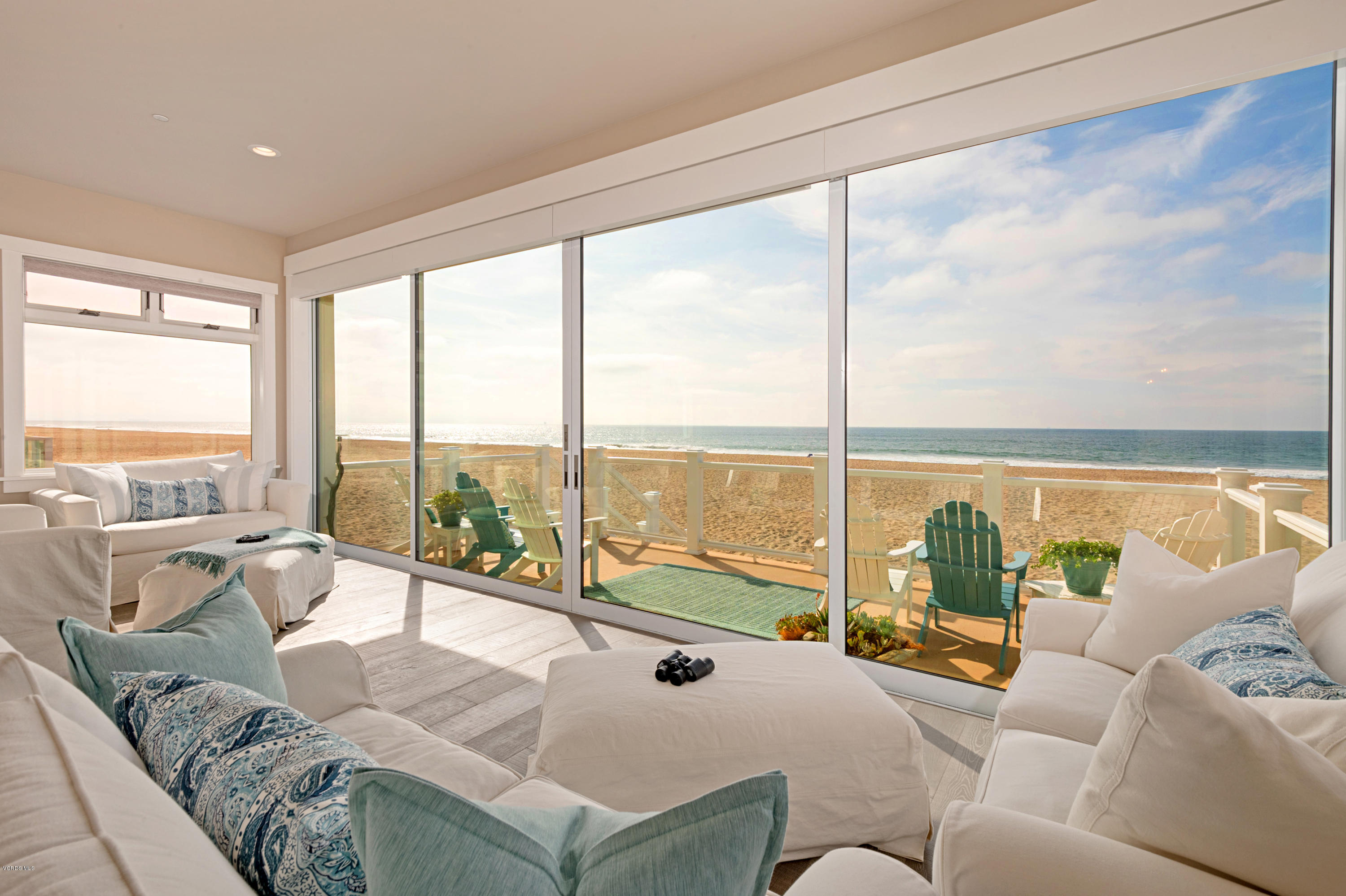 935 Mandalay Beach Road Oxnard, CA 93035 - Photo 21 of 67 a living room with furniture and floor to ceiling windows