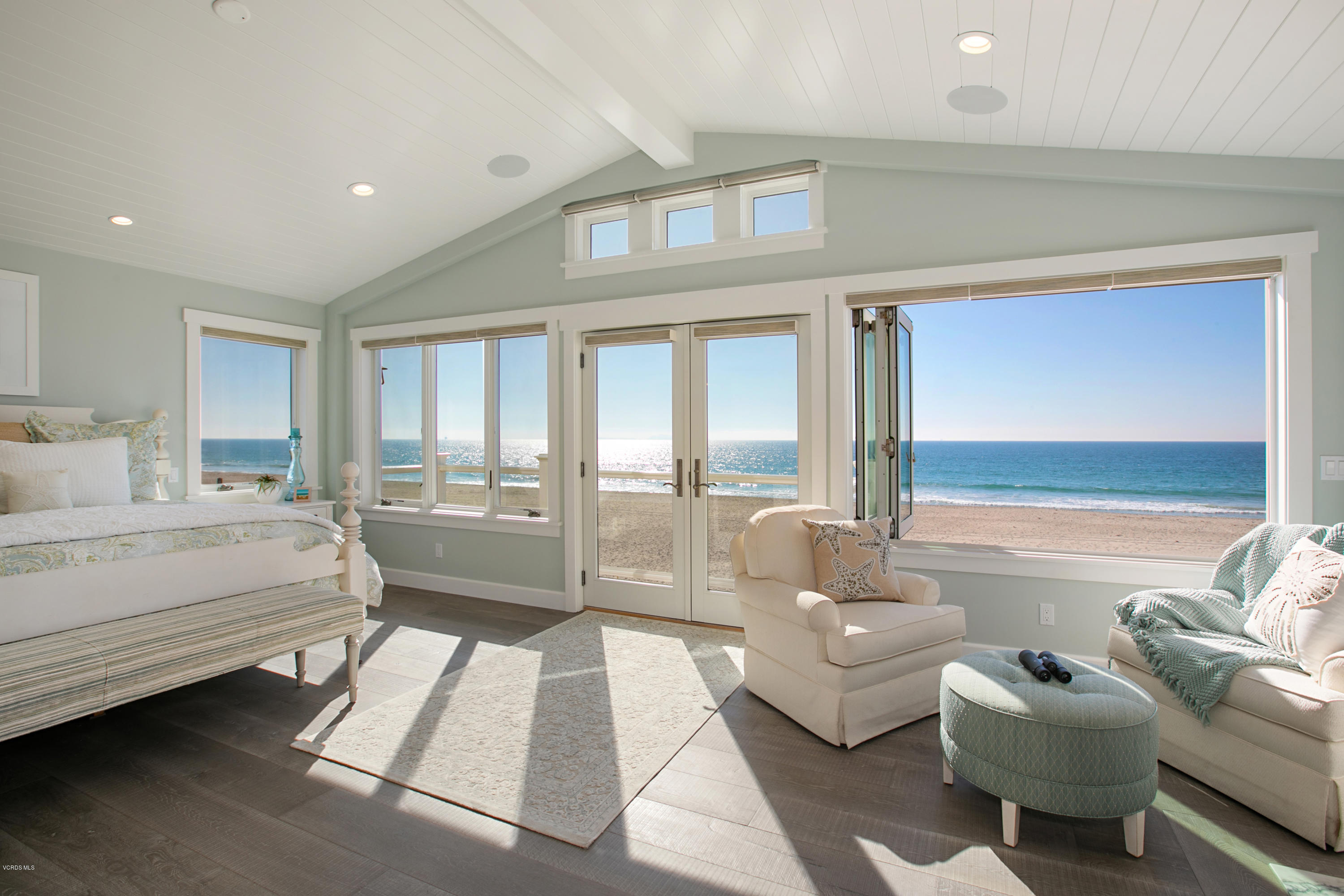 935 Mandalay Beach Road Oxnard, CA 93035 - Photo 27 of 67 a spacious bedroom with a bed and glass windows