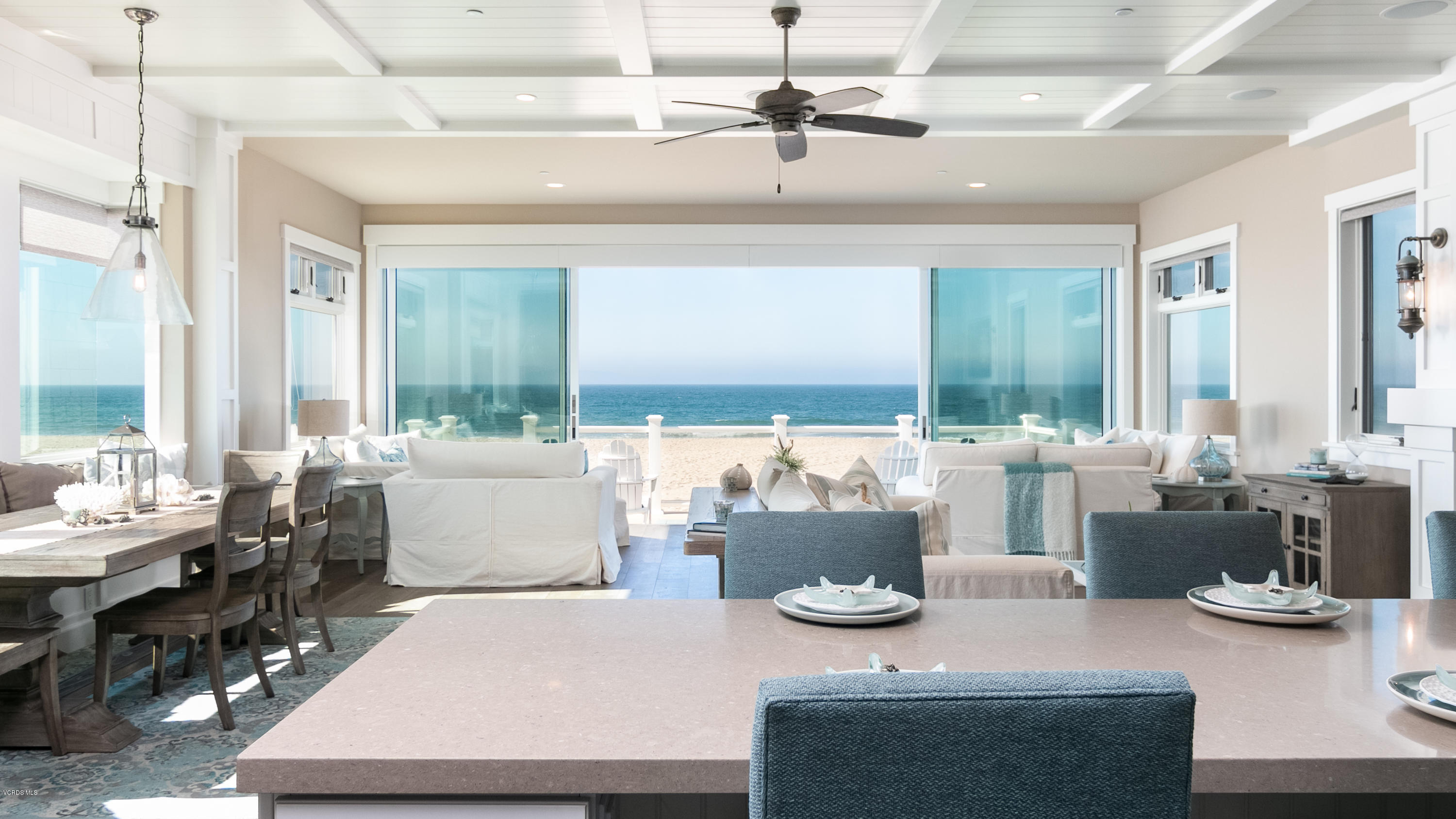 935 Mandalay Beach Road Oxnard, CA 93035 - Photo 3 of 67 a living room with lots of white furniture and a table