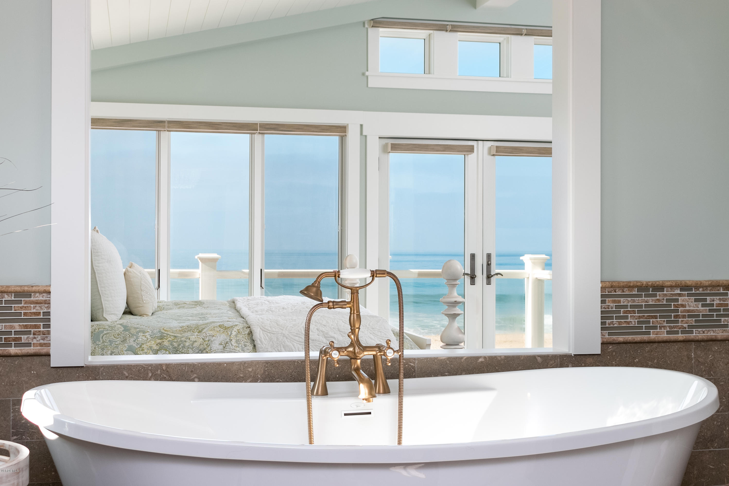 935 Mandalay Beach Road Oxnard, CA 93035 - Photo 31 of 67 a bathroom with a granite countertop sink and a bathtub