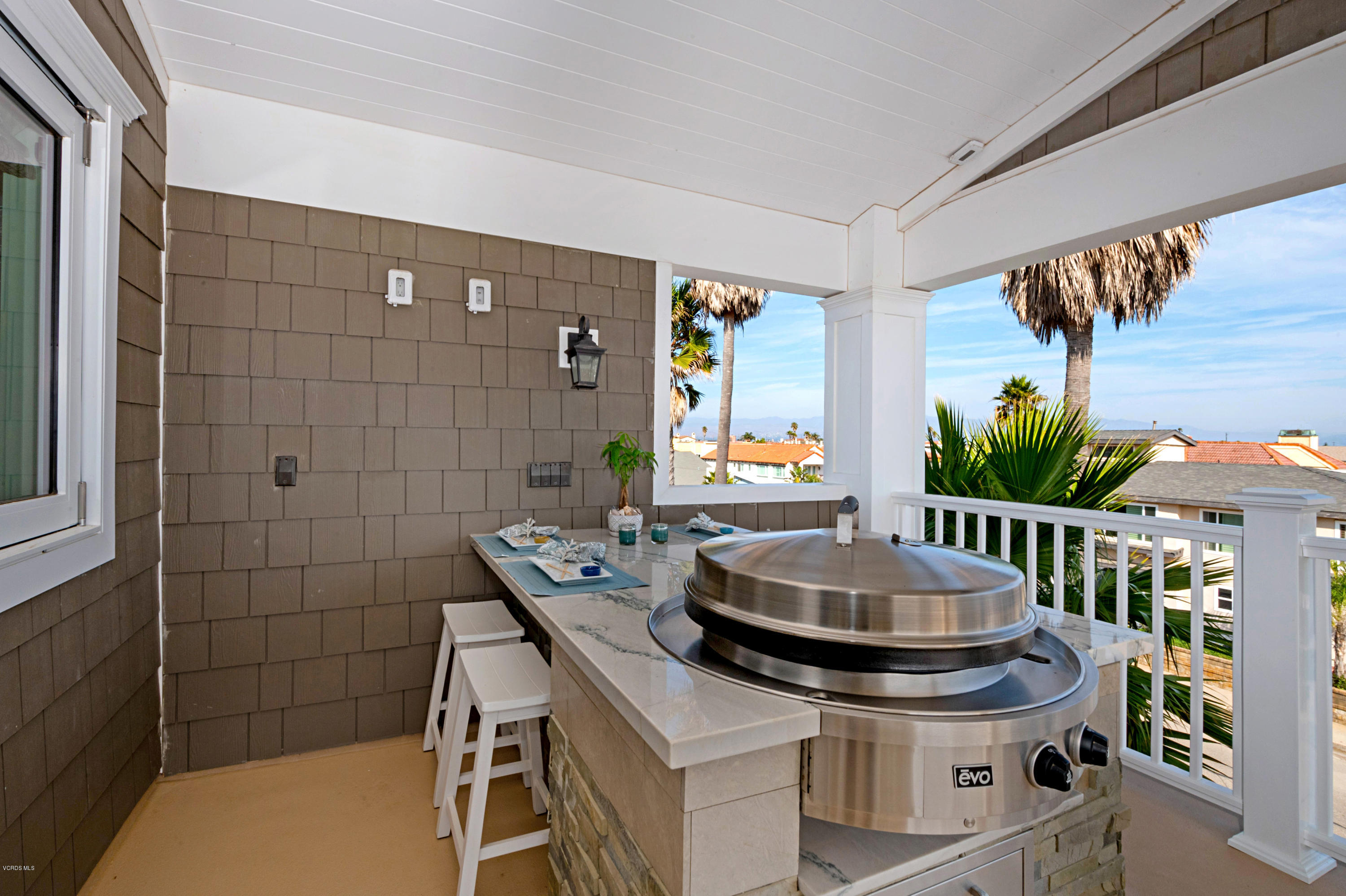 935 Mandalay Beach Road Oxnard, CA 93035 - Photo 40 of 67 a kitchen with a sink a stove and a table
