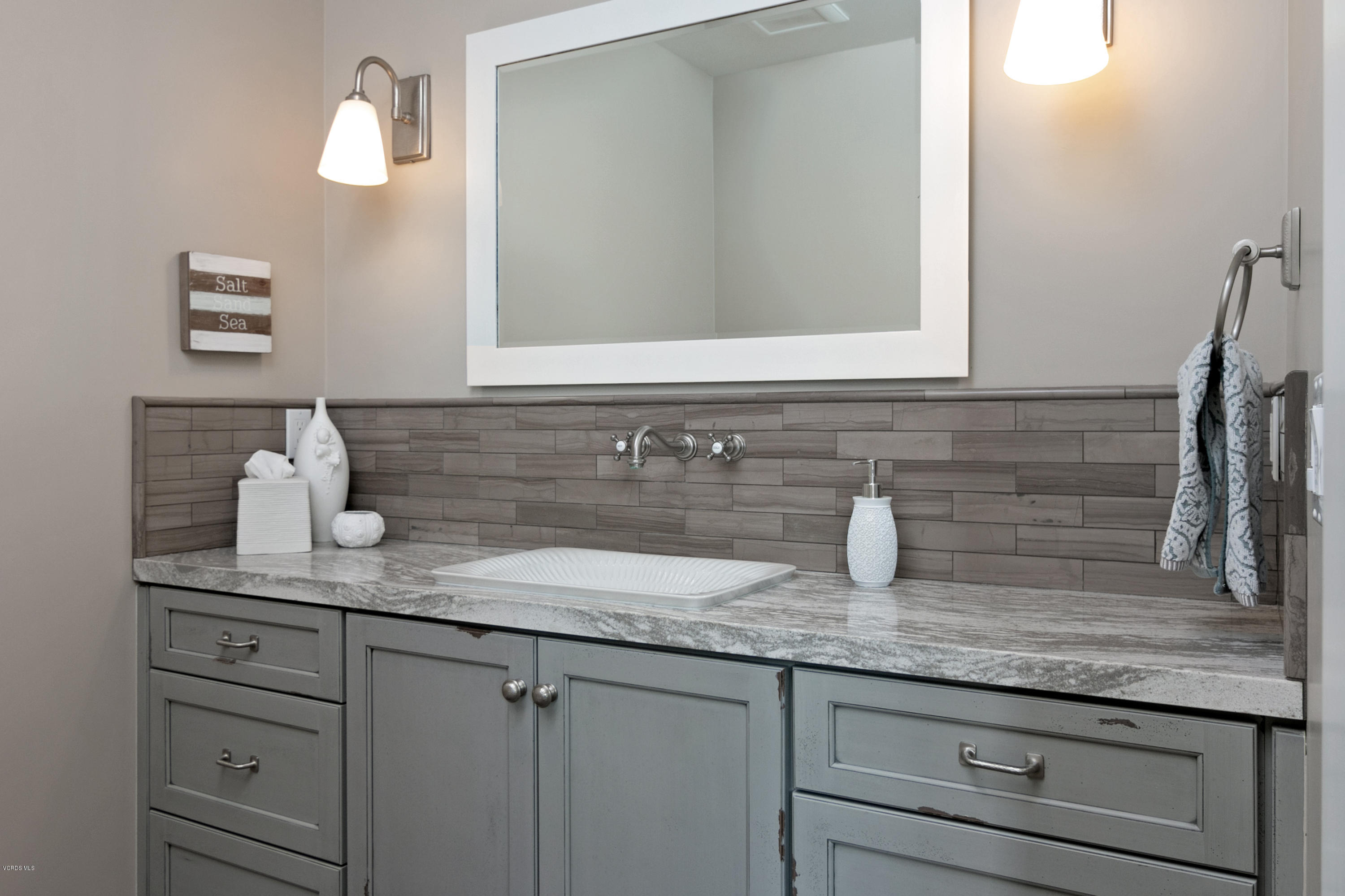 935 Mandalay Beach Road Oxnard, CA 93035 - Photo 52 of 67 a bathroom with sink and mirror
