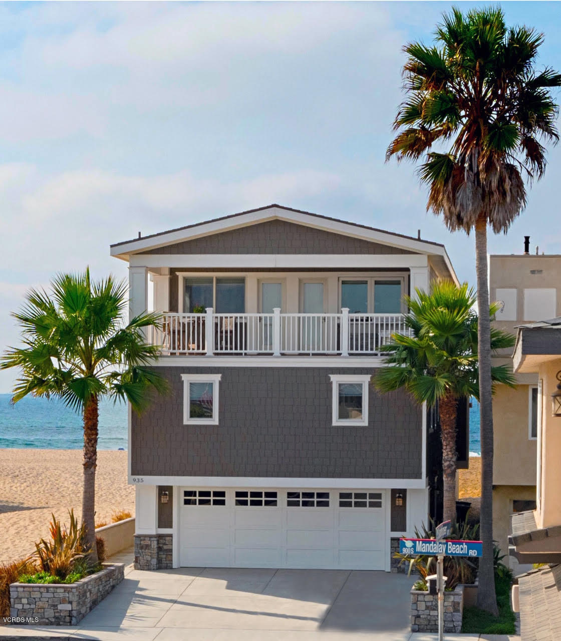 935 Mandalay Beach Road Oxnard, CA 93035 - Photo 60 of 67 a front view of a house with a garden and a yard