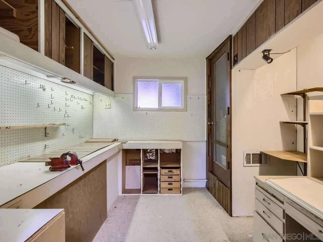 16319 Gabarda Road San Diego, CA 92128 - Photo 23 of 30 a view of a kitchen with fridge and wooden floor