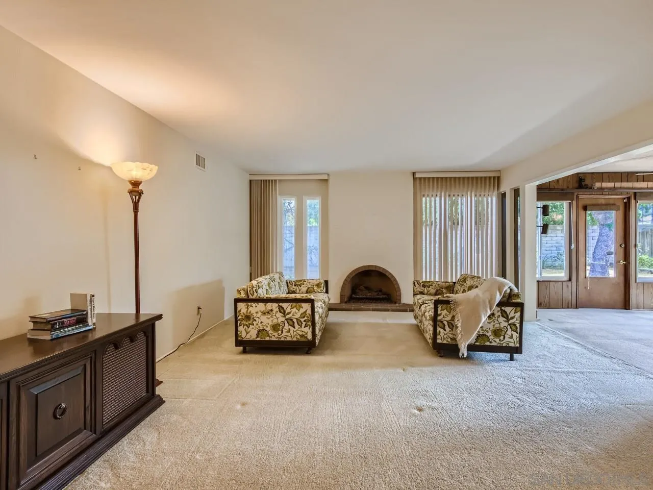 16319 Gabarda Road San Diego, CA 92128 - Photo 5 of 30 a living room with furniture and large windows